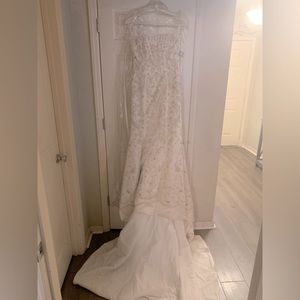 NWT.  Ivory/Gold mermaid/ corset wedding dress.Size 4.